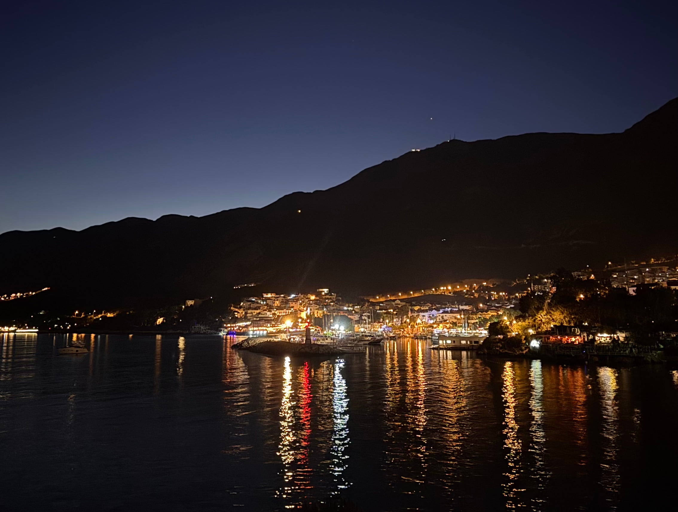 Ancient Lycian Rock Tombs at night in Kaş, Turkey